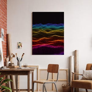 May include: Abstract art print featuring a colorful, undulating wave pattern. The artwork transitions from deep purple at the bottom to vibrant red, orange, yellow, and blue at the top, set against a black background. The piece is displayed in a room with art supplies.