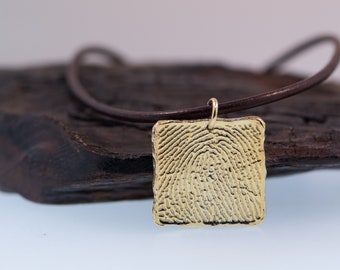 Square Fingerprint shaped Gold Charm.