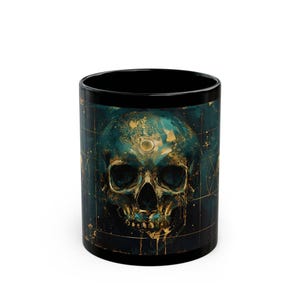 May include: Black ceramic mug featuring a detailed skull design. The skull is rendered in shades of teal and gold, with intricate details and a celestial background. The mug has a black interior and rim.