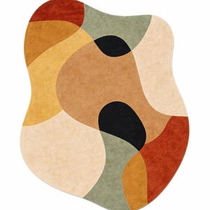 This Hand Tufted rug are in shades of cream, light gray, and dark gray. Each mug has a simple, minimalist design and a rounded handle.