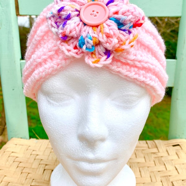 Pink Cotton Candy Sprinkles crochet head band with a confetti pink crochet flower that has a button center