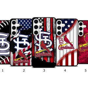 May include: Five phone cases featuring the St. Louis Cardinals logo and imagery. Designs include the team's logo, a baseball, the American flag, and a cardinal bird. The cases are black with red, white, and blue accents.