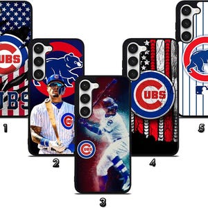 May include: Five phone cases featuring Chicago Cubs baseball team designs. The cases display the team logo, a bear, and a player. The backgrounds include the American flag and baseball-themed graphics. The cases are black.