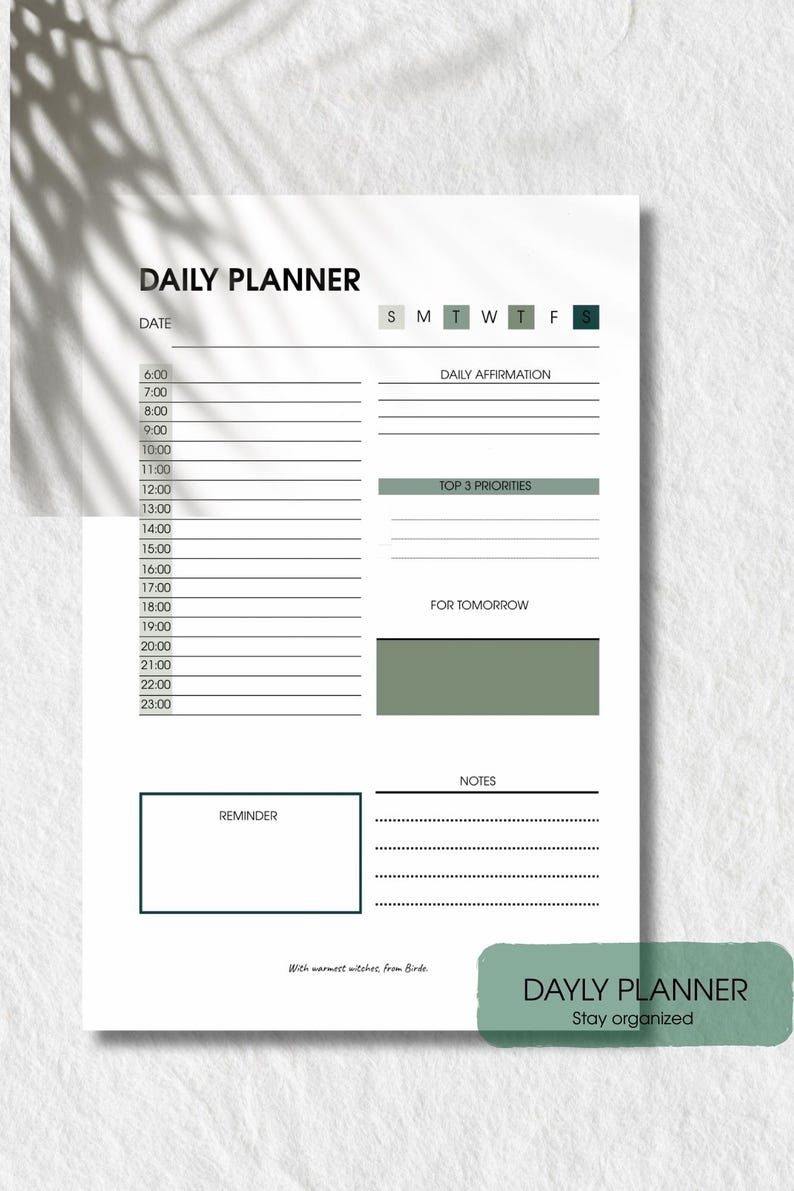 May include: A white daily planner with a minimalist design. The planner includes sections for time slots, daily affirmations, top priorities, reminders, and notes. The text "DAILY PLANNER" is at the top, with "DAYLY PLANNER" at the bottom.