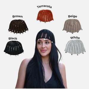 May include: A collection of five crochet caps in brown, terracotta, beige, black, and white. Each cap features a vertical open-knit pattern and small circular charms along the bottom edge. The black cap is shown worn on a head, while the others are displayed separately with their respective color labels.
