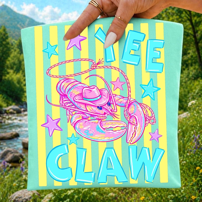 Funny 'Yee Claw' cowboy lobster graphic applied to a white t-shirt, perfect for summer beach wear.