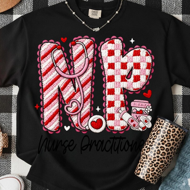 May include: Black t-shirt with a design featuring the letters "NP" in pink and red, a stethoscope, hearts, and the words "Nurse Practitioner". A leopard print tumbler is visible.