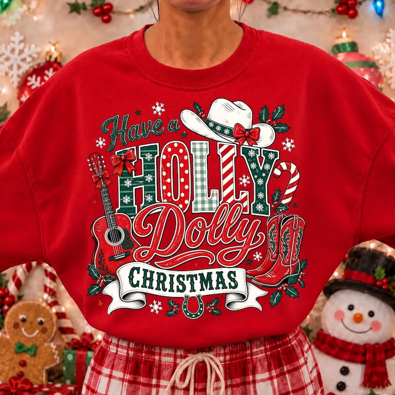 May include: A red crewneck sweatshirt featuring a graphic print with the text Have a HOLLY Dolly CHRISTMAS. The design includes a white cowboy hat, a red acoustic guitar, a candy cane, and red cowboy boots, accented with holly and snowflakes.