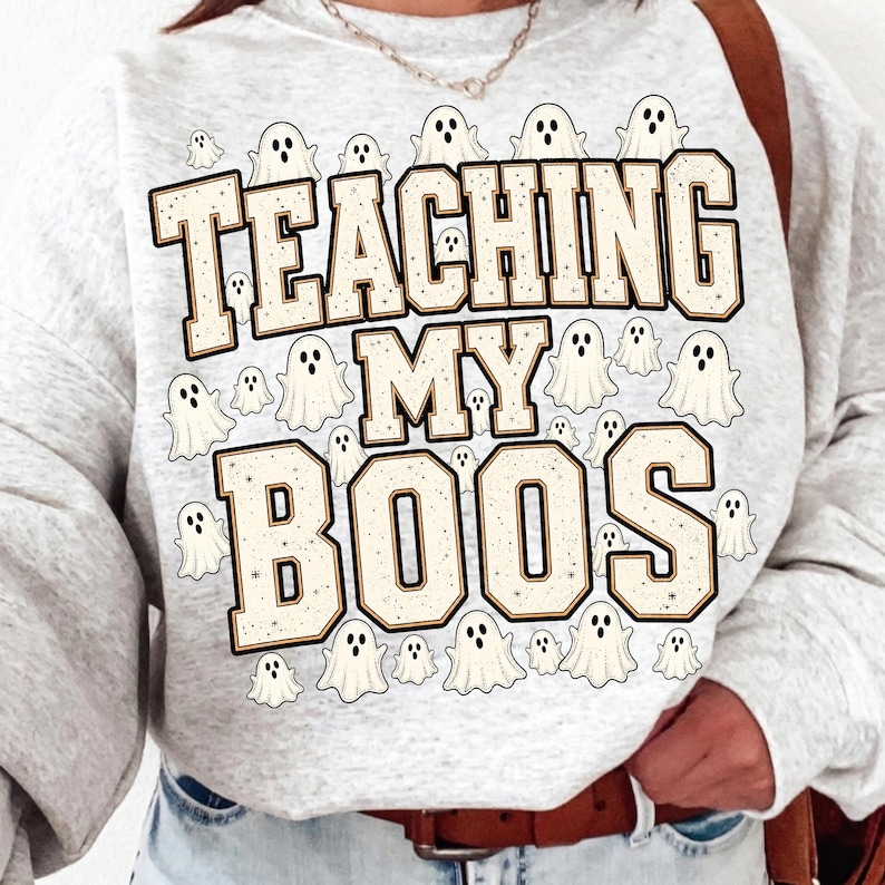 Teacher Wearing Teaching My Boos Halloween Shirt