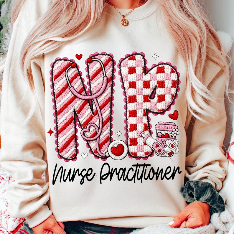 May include: Cream-colored sweatshirt with a graphic design featuring the letters "NP" in red and white, a stethoscope, hearts, and the words "Nurse Practitioner". The design includes a checkerboard pattern and medical-themed illustrations.