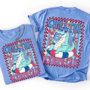 May include: A light blue t-shirt featuring a graphic of a light green alligator wearing star-shaped sunglasses, sitting on a red, white, and blue striped pool float, holding a popsicle, with the text CHILL THE FOURTH OUT and small stars.