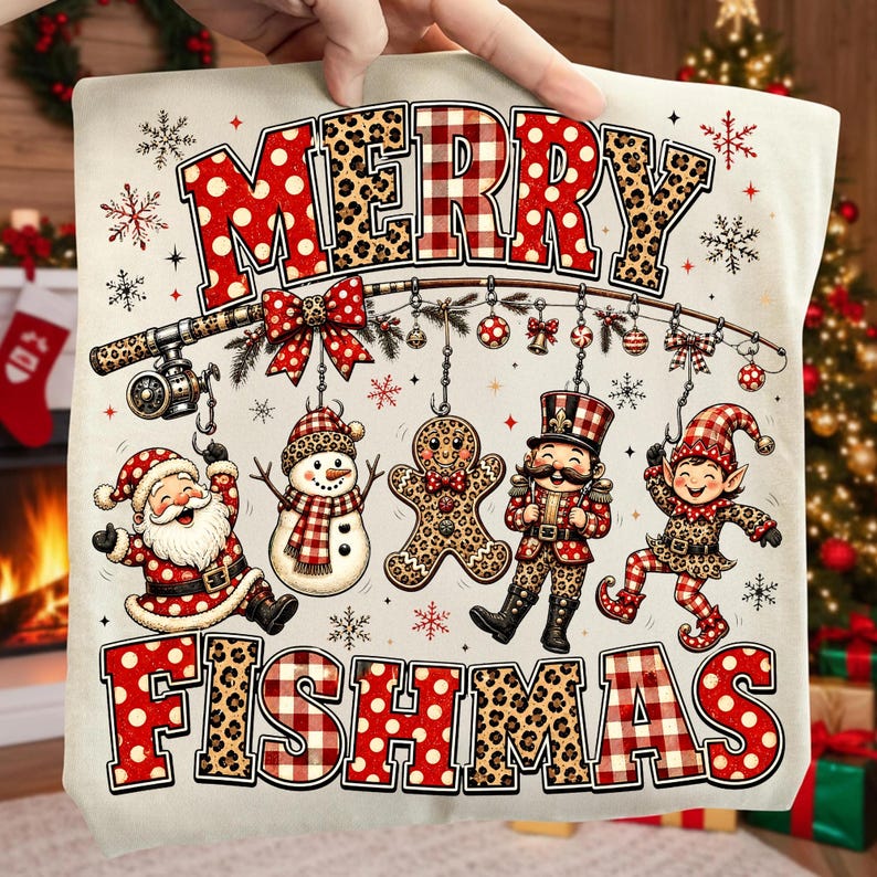 May include: A cream-coloured fabric featuring the text MERRY FISHMAS in red polka dot and leopard print letters. A fishing rod hangs ornaments, a Santa Claus, a snowman, a gingerbread man, a nutcracker, and an elf, all with festive patterns.