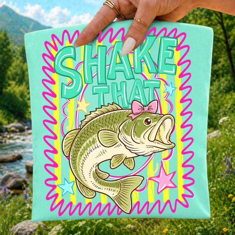 Mockup of a t-shirt featuring the 'Shake That Bass' funny fishing sublimation design.