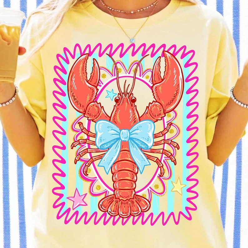 Vibrant Crawfish Coquette design on a striped shirt, showcasing preppy coastal style.