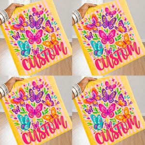 May include: A yellow fabric square featuring a repeating pattern of colorful butterflies in shades of pink, purple, orange, and teal, accented with green leaves and small stars. The word "custom" is printed in a large, bold, hot pink script font.