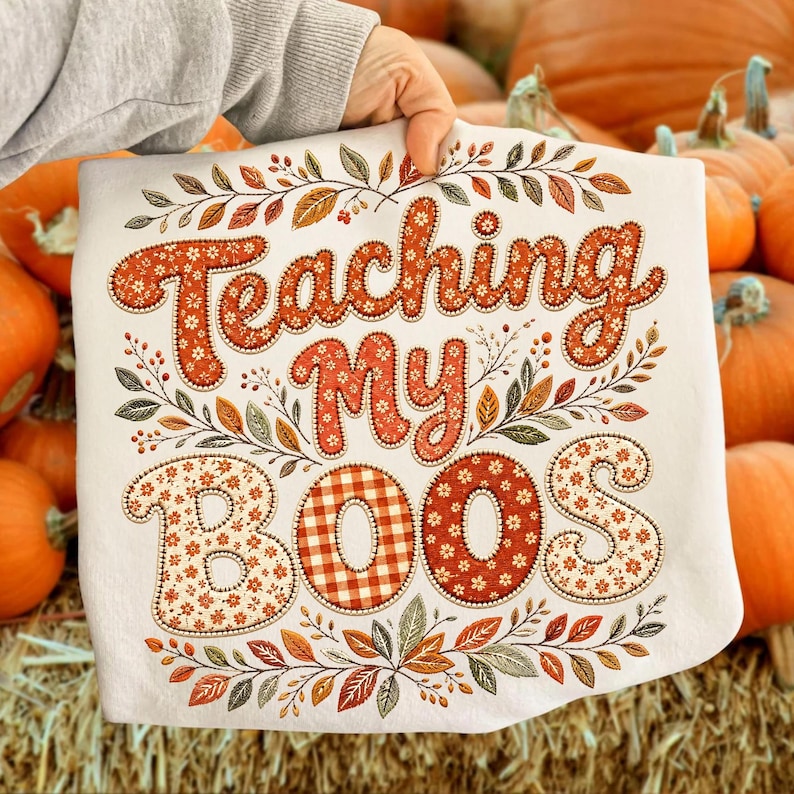 Retro floral autumn teacher shirt design featuring Teaching My Boos text