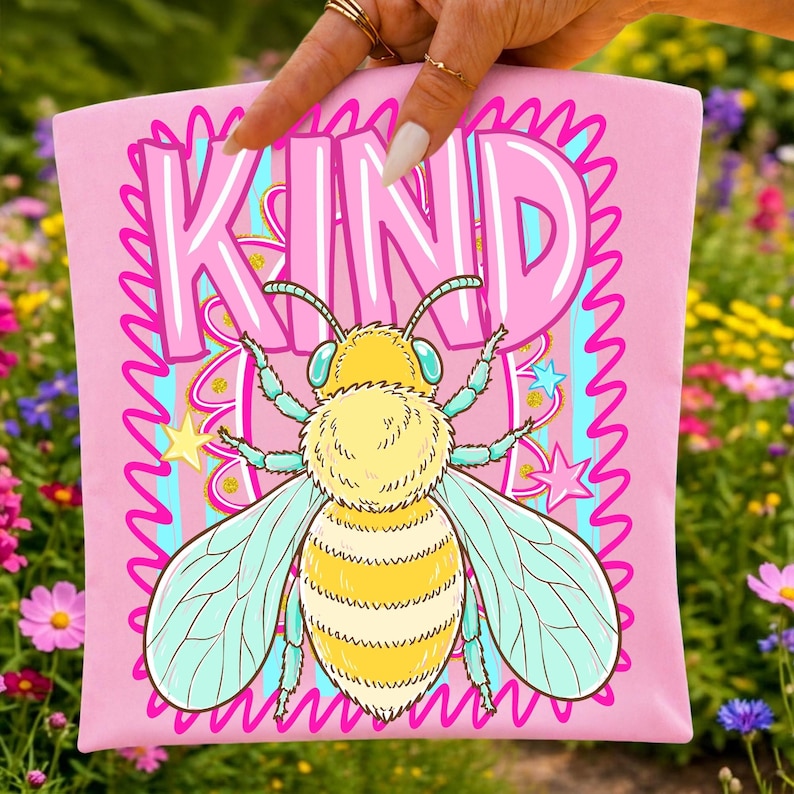Close-up of the Bee Kind retro sublimation design featuring a honey bee and striped elements.