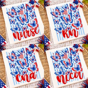 May include: A white t-shirt featuring a patriotic design with red, white, and blue butterflies, American flag icons, and light blue vertical stripes. The text reads nurse, rn, cna, or nicu in a bold red script font across the bottom of the graphic.