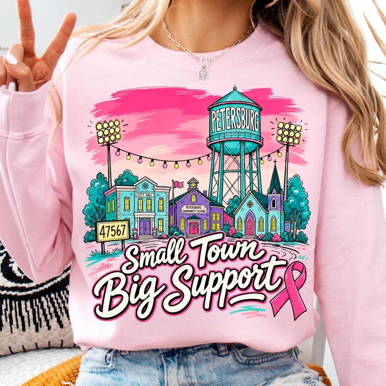 Variety of 'Small Town Big Support' Design Mockups on T-shirts, Mugs, and Tumblers