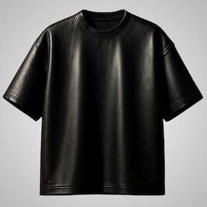 May include: A black leather t-shirt with a crew neck and short sleeves. The shirt has a smooth, matte finish and a relaxed fit. The garment is displayed against a neutral background.