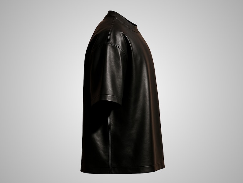 May include: A black leather t-shirt with short sleeves. The shirt has a crew neck and a straight hem. The material appears to be smooth and shiny, with visible stitching along the seams. The shirt is displayed against a neutral background.