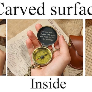 May include: A vintage-style brass compass with a leather case. The compass features a detailed face and a chain. The back of the compass is engraved with the name "Michael" and the letter "M". The text "Carved surface" is at the top.