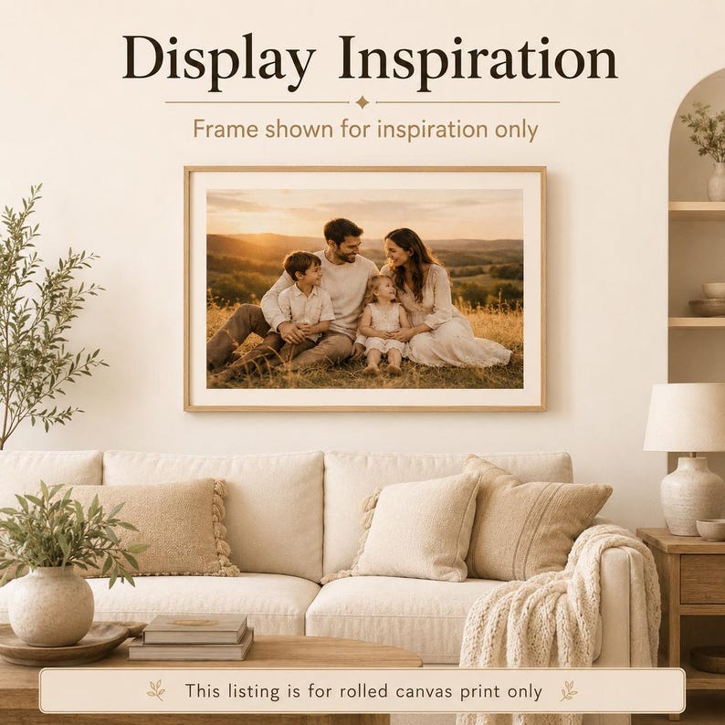 May include: A rectangular wall art print featuring a family of three sitting in a grassy field at sunset, displayed in a light wood frame. The text above reads Display Inspiration, and the bottom text states This listing is for rolled canvas print only.
