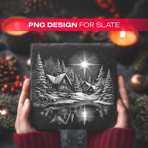 May include: Black and white slate coaster featuring a winter landscape with cabins, trees, and a bright star. The text "PNG DESIGN FOR SLATE" is displayed at the top. The coaster is held by a person wearing a red sweater.