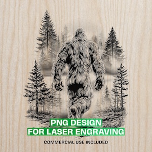 May include: A black and white illustration of Bigfoot walking through a forest, with pine trees in the background. The text "PNG DESIGN FOR LASER ENGRAVING" is in a green box at the bottom, with "COMMERCIAL USE INCLUDED" below it.