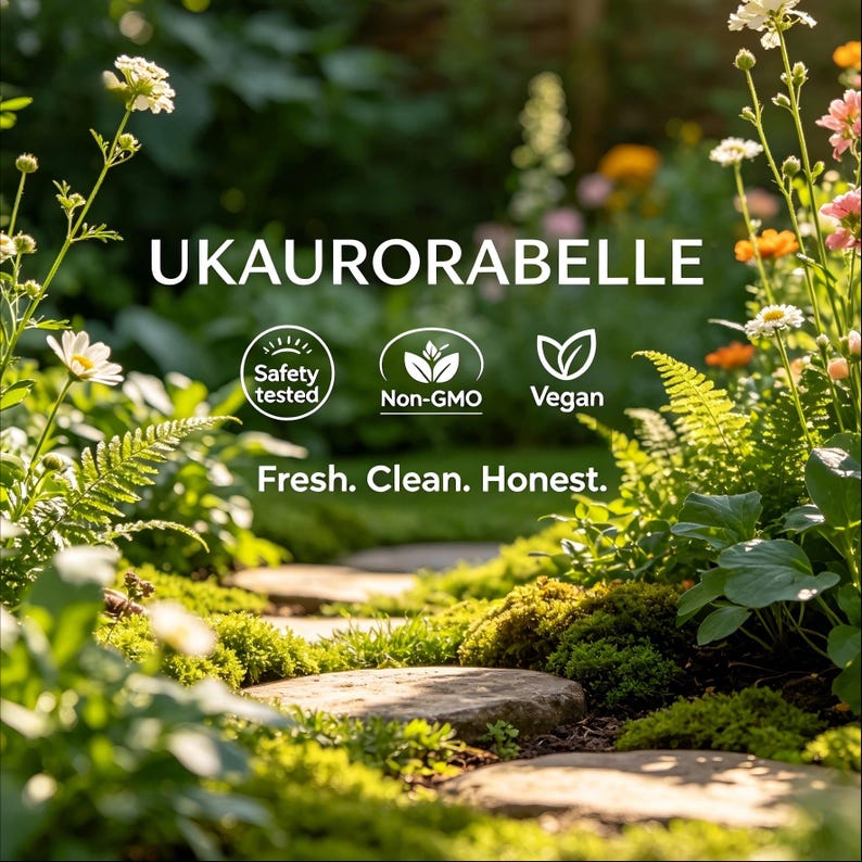 May include: A garden path with stepping stones, surrounded by lush greenery and colorful flowers. The image includes the text "UKAUROABELLE", along with icons indicating safety testing, non-GMO, and vegan attributes. The tagline reads "Fresh. Clean. Honest."