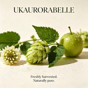 May include: A close-up of fresh green hops, a green apple, and a white flower with green leaves. The image has the text "Freshly harvested. Naturally pure." and the brand name "UKAUORARABELLE".