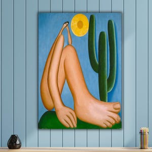 May include: A colorful painting depicts a figure with elongated limbs, seated near a cactus under a yellow sun against a blue sky. The artwork is displayed above a wooden cabinet with a slatted design.