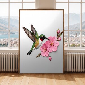 以下が含まれることがあります： 緑、白、赤の羽毛を持つハチドリが、鮮やかなピンクの桜の花と閉じた蕾がついた茶色の枝に向かって飛んでいる様子を描いた、額装されたウォールアートプリント。背景は無地の白です。