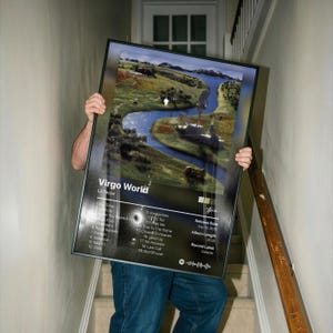 May include: A framed rectangular poster featuring the Virgo World album cover by Lil Tecca. The artwork displays a winding river through a green landscape, with a tracklist, release date of Sep 18, 2020, and album length of 45:41 printed below.