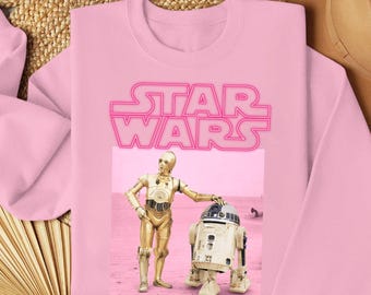 Droides de Star Wars retro de los 90 PNG, retrato de neón rosa de R2-D2 y C-3PO, diseño Galaxy's Edge, descarga digital