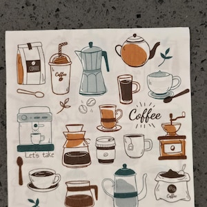 May include: White napkin with various coffee-themed illustrations in brown, orange, and teal. Depicted are coffee beans, a coffee maker, a grinder, cups, a teapot, and the word "Coffee". The phrase "Let's take" is also present.