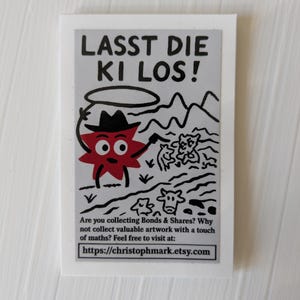 May include: A white rectangular sticker with the text "LASST DIE KI LOS!" and a cartoon illustration. The illustration features a red star-shaped character wearing a hat, with cows and mountains in the background. The sticker also includes a website address.