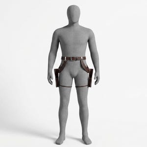 May include: A dark brown leather dual holster rig featuring a waist belt with a silver-toned metal buckle, two side-mounted holsters, and adjustable leg straps. The leather gear is displayed on a featureless gray mannequin against a white background.