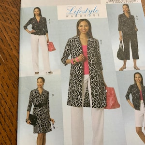 May include: A sewing pattern for a women's jacket, pants, and dress. The pattern includes four different styles, all featuring a geometric print. The pattern is from Lifestyle Wardrobe.