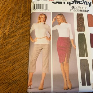 May include: A sewing pattern for six different bottoms, including a skirt, pants, and capris. The pattern is from Simplicity and is labeled "6 bottoms made easy".