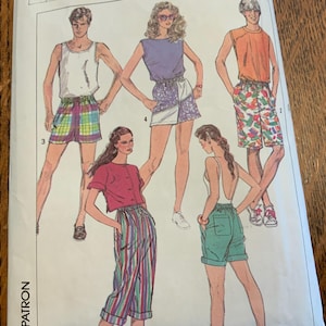 May include: Illustration of various outfits, including shorts, tank tops, and a crop top with striped pants. The outfits feature a range of colors and patterns, including plaid, floral, and stripes. The image is a vintage fashion illustration.