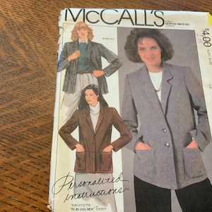 May include: McCall's sewing pattern for a jacket, featuring illustrations of the jacket in different colors and styles. The pattern includes the text "Personalized instructions" and "fit as you sew" system. The pattern is for Misses sizes 14 and 36.