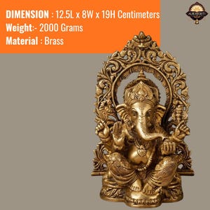 May include: A brass Ganesha statue featuring intricate carvings and an ornate archway backdrop. The statue measures 12.5L x 8W x 19H centimeters and weighs 2000 grams. The deity is depicted in a seated position with four arms and a trunk.
