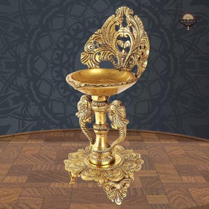 Brass Oil Diya with Twin Peacock Design – Ethnic Puja Lamp for Home Decor 9 Inch, Housewarming Gift, Temple Diya, Pack of 1