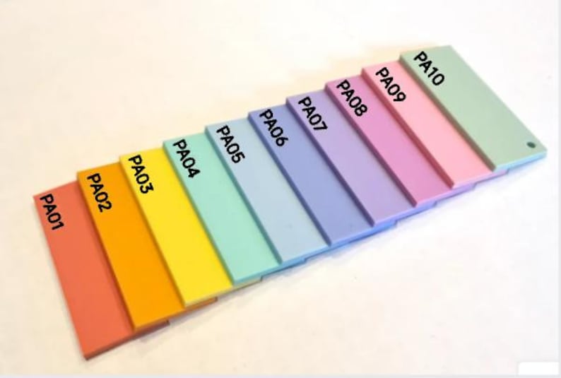 May include: A color palette of ten rectangular acrylic paint swatches in a gradient of colors, from coral to light green. Each swatch is labeled with "PA" followed by a number. The palette is arranged diagonally.