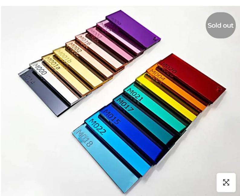 May include: A collection of rectangular acrylic color swatches in various shades, including black, white, gold, pink, purple, red, orange, yellow, green, and blue. Each swatch is labeled with a code. The image shows a 'Sold out' label.