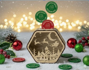 May include: A hexagonal wooden box with a cutout design of a village, a crescent moon, and a sleigh pulled by reindeer. Several circular tokens are present, featuring a Santa face and text including "Christmas Award" and "Officially on the Nice List."