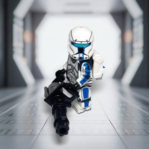 May include: A white and blue Lego minifigure, resembling a futuristic soldier, stands holding a black weapon. The figure has a white helmet with blue accents and detailed armor. The background is a blurred, futuristic corridor.