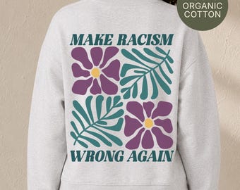 Sweat-shirt antiraciste en coton bio, imprimé floral au dos, col rond, symbole de justice sociale.