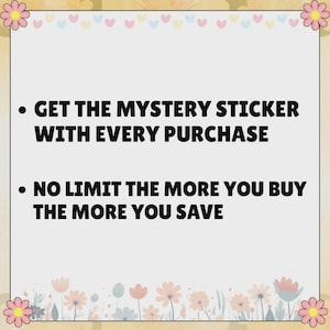 May include: A square sign with a light gray background and a border decorated with pink flowers and small hearts. The text reads: GET THE MYSTERY STICKER WITH EVERY PURCHASE and NO LIMIT THE MORE YOU BUY THE MORE YOU SAVE in bold black letters.